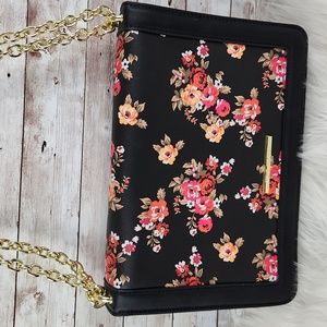Steve Madden, Black floral crossbody bag, gold chain, with flap over.